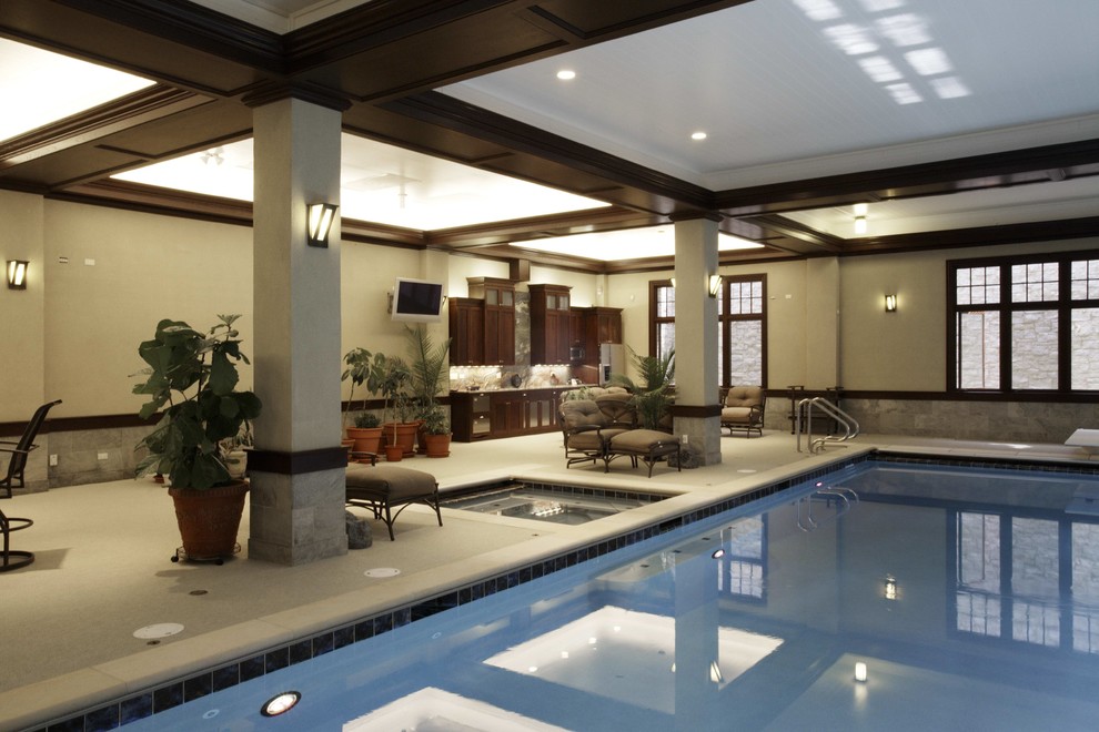 Inspiration for a mid-sized contemporary indoor rectangular pool in Chicago with a hot tub.