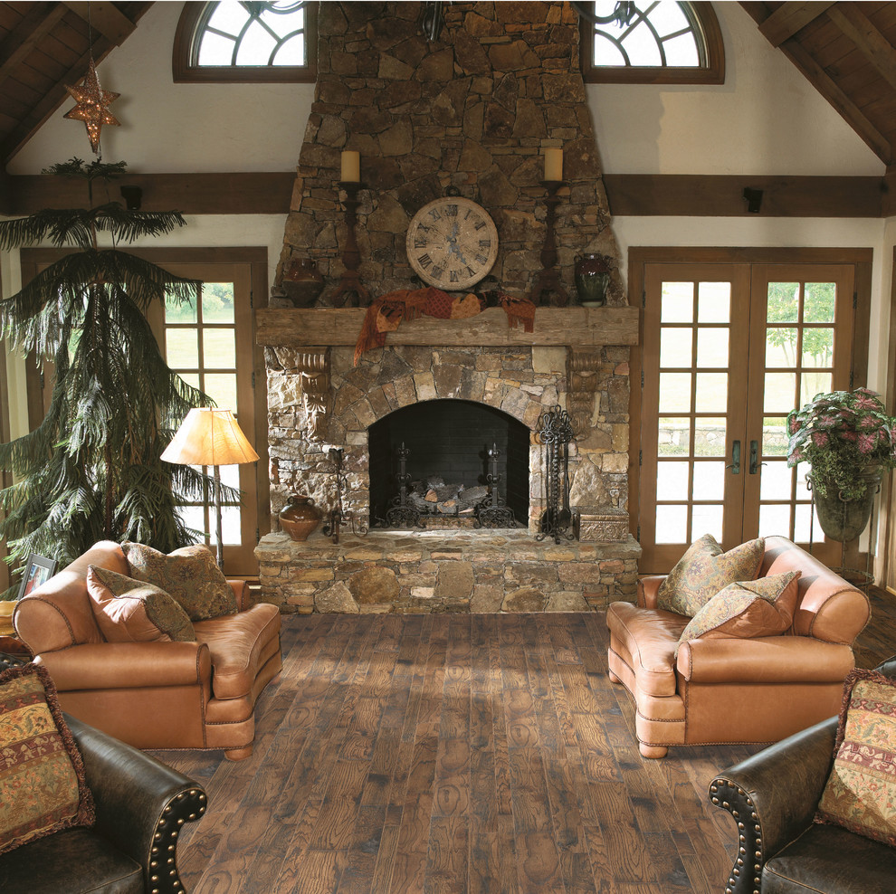 Design ideas for a mid-sized country formal enclosed living room in Other with brown walls, vinyl floors, a standard fireplace, a stone fireplace surround, no tv and brown floor.