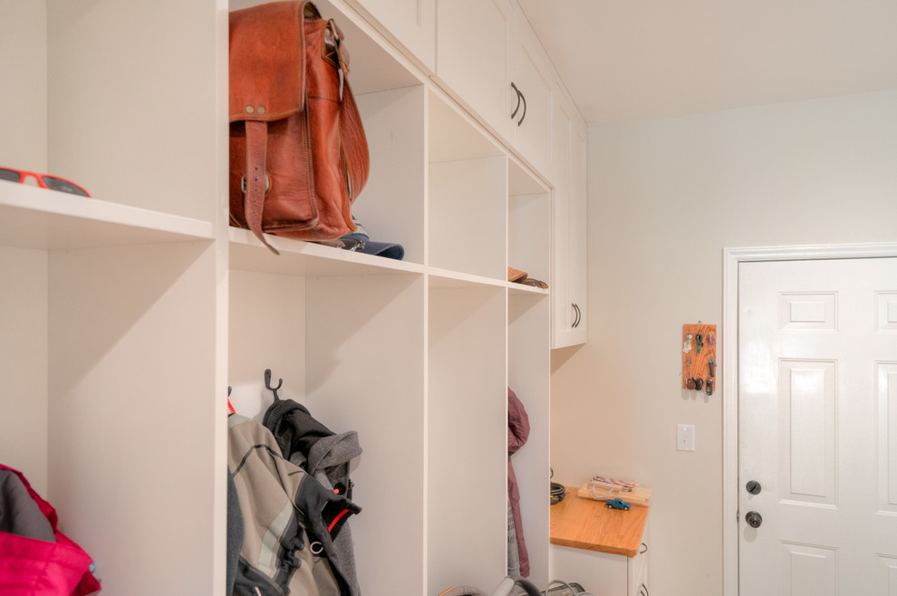 Mid-sized transitional light wood floor mudroom photo
