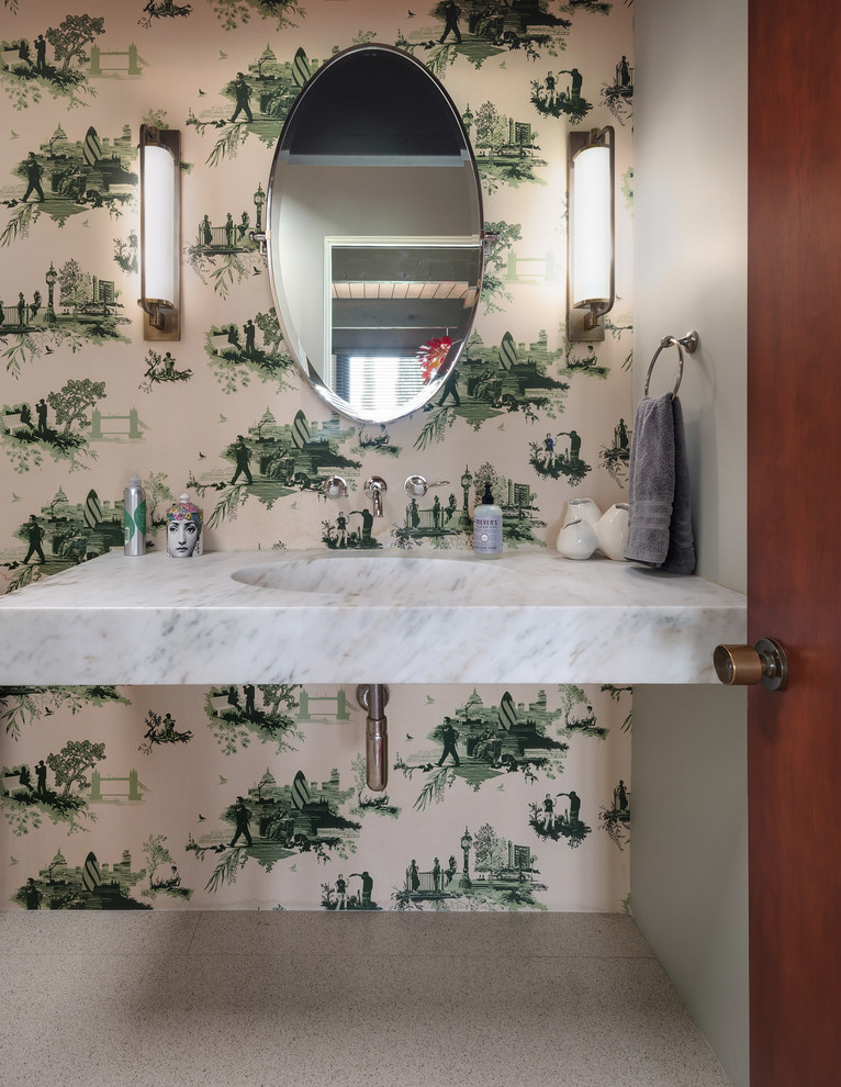 Mid-sized midcentury powder room in Los Angeles with a wall-mount sink, marble benchtops, white benchtops, green walls and beige floor.