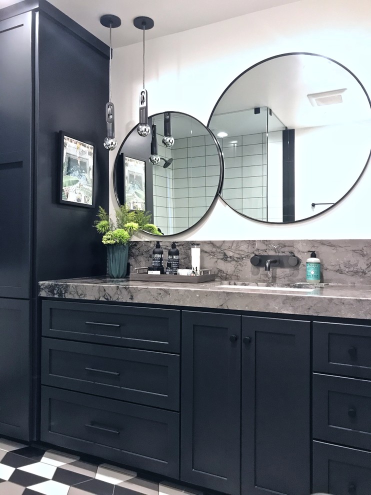 Design ideas for a mid-sized transitional 3/4 bathroom in Orange County with shaker cabinets, black cabinets, a one-piece toilet, white tile, ceramic tile, white walls, porcelain floors, an undermount sink, marble benchtops, multi-coloured floor, a hinged shower door and grey benchtops.