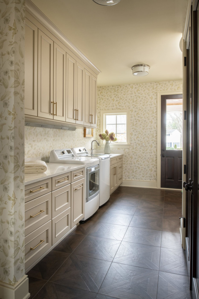 Design ideas for a medium sized classic single-wall utility room in Minneapolis with a single-bowl sink, shaker cabinets, beige cabinets, engineered stone countertops, multi-coloured walls, dark hardwood flooring, a side by side washer and dryer, brown floors and white worktops.