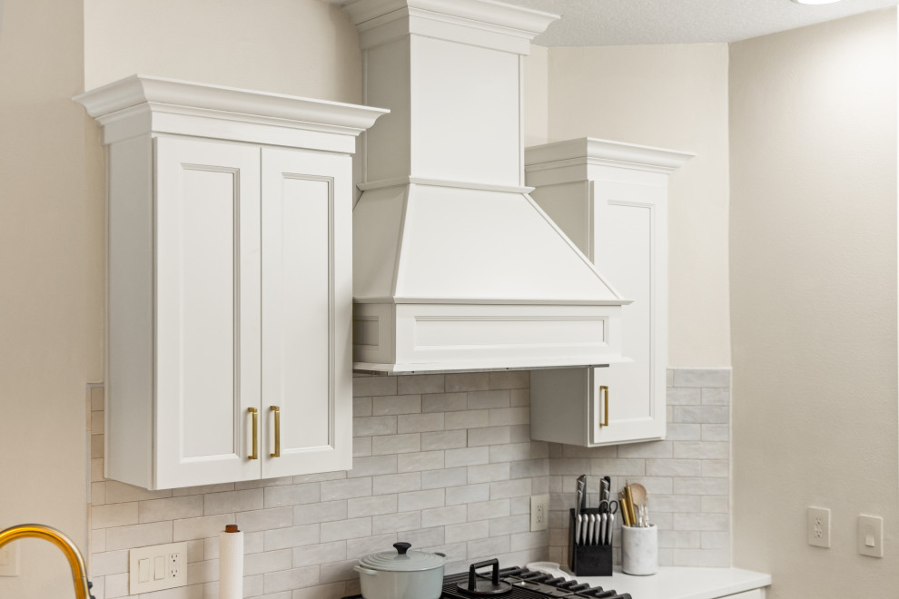 Inspiration for a small transitional l-shaped light wood floor and multicolored floor eat-in kitchen remodel in Tampa with an undermount sink, shaker cabinets, beige cabinets, quartzite countertops, beige backsplash, porcelain backsplash, stainless steel appliances, a peninsula and white countertops