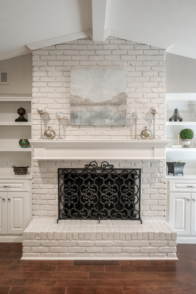 Mid-sized transitional enclosed family room in Dallas with grey walls, medium hardwood floors, a standard fireplace, a brick fireplace surround and a built-in media wall.