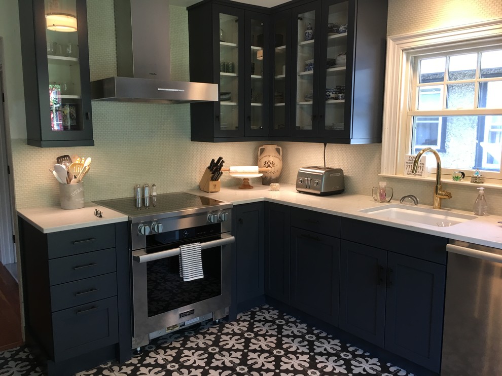 This is an example of a large transitional l-shaped separate kitchen in Providence with an undermount sink, shaker cabinets, blue cabinets, quartzite benchtops, grey splashback, mosaic tile splashback, stainless steel appliances, ceramic floors, no island, multi-coloured floor and white benchtop.