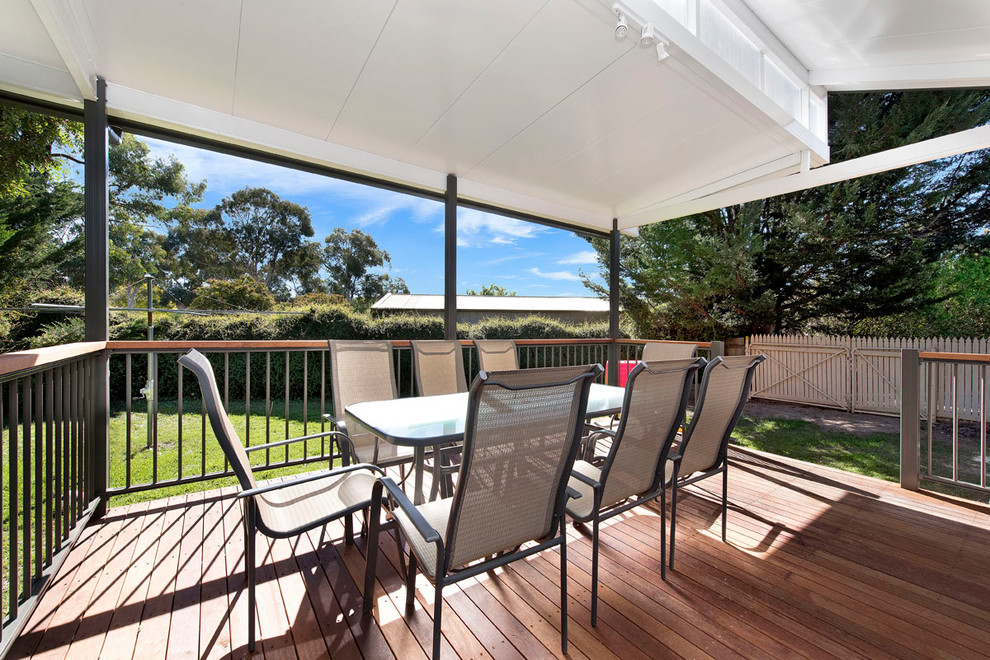 Design ideas for a contemporary backyard deck in Canberra - Queanbeyan with a roof extension.