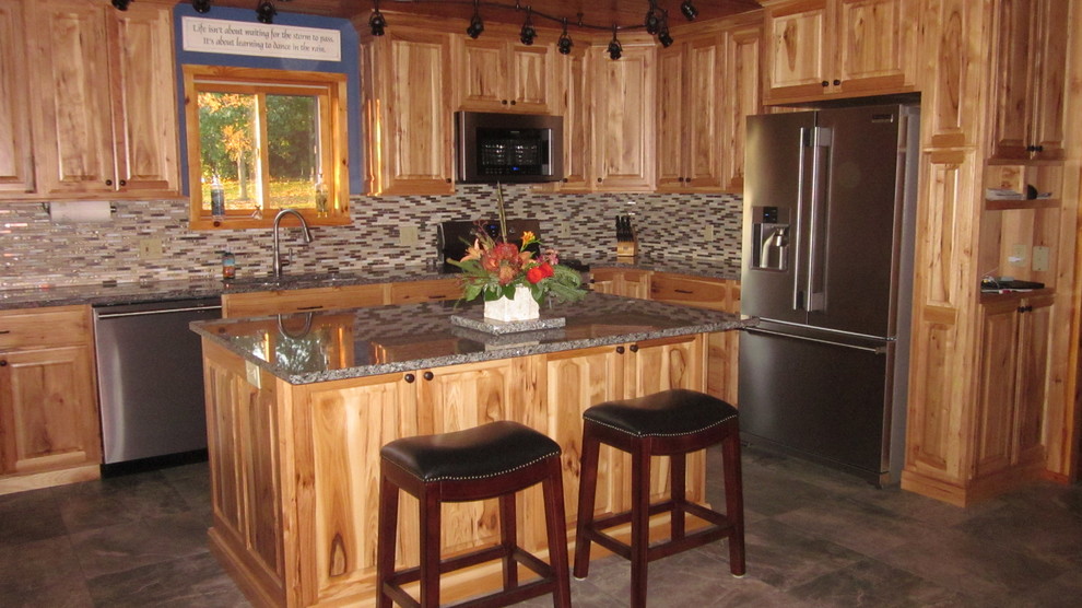 Eat-in kitchen - mid-sized rustic l-shaped porcelain tile and gray floor eat-in kitchen idea with a double-bowl sink, raised-panel cabinets, light wood cabinets, granite countertops, multicolored backsplash, matchstick tile backsplash, stainless steel appliances and an island