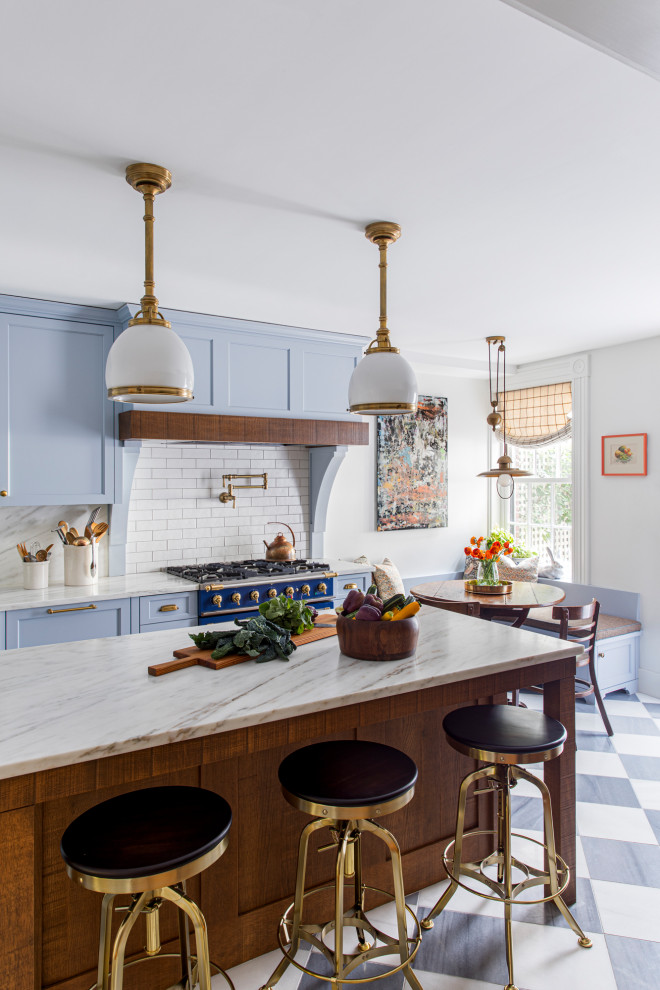Inspiration for a mid-sized eclectic l-shaped marble floor enclosed kitchen remodel in Boston with a farmhouse sink, recessed-panel cabinets, blue cabinets, marble countertops, subway tile backsplash and an island