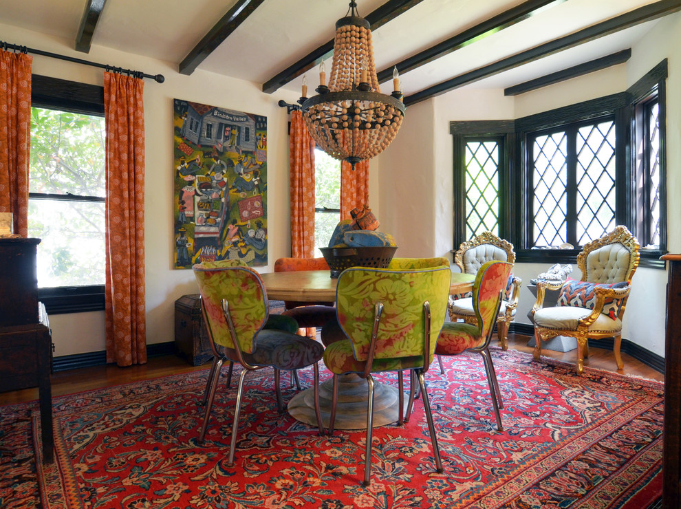 Eclectic dining room in Dallas with white walls, medium hardwood floors and no fireplace.