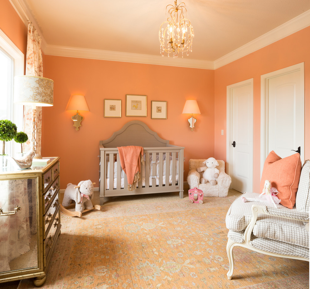 Inspiration for a mid-sized traditional nursery for girls in Kansas City with orange walls, carpet and orange floor.