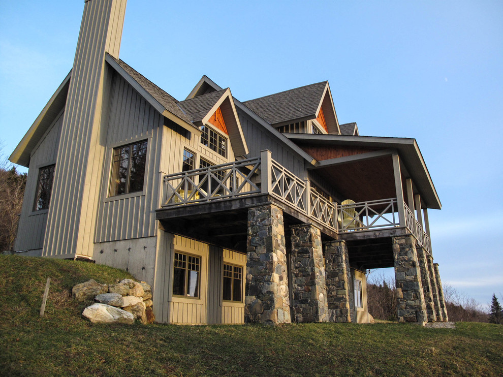 Mid-sized rustic beige three-story wood exterior home idea in Montreal with a shingle roof