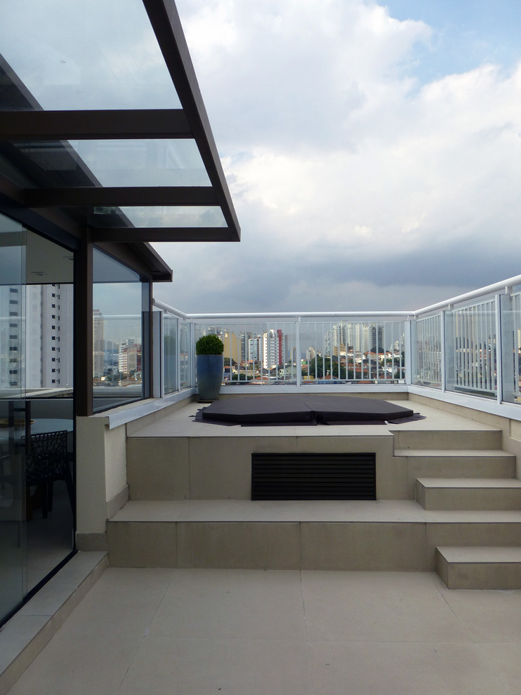 This is an example of a large contemporary rooftop deck in Other.