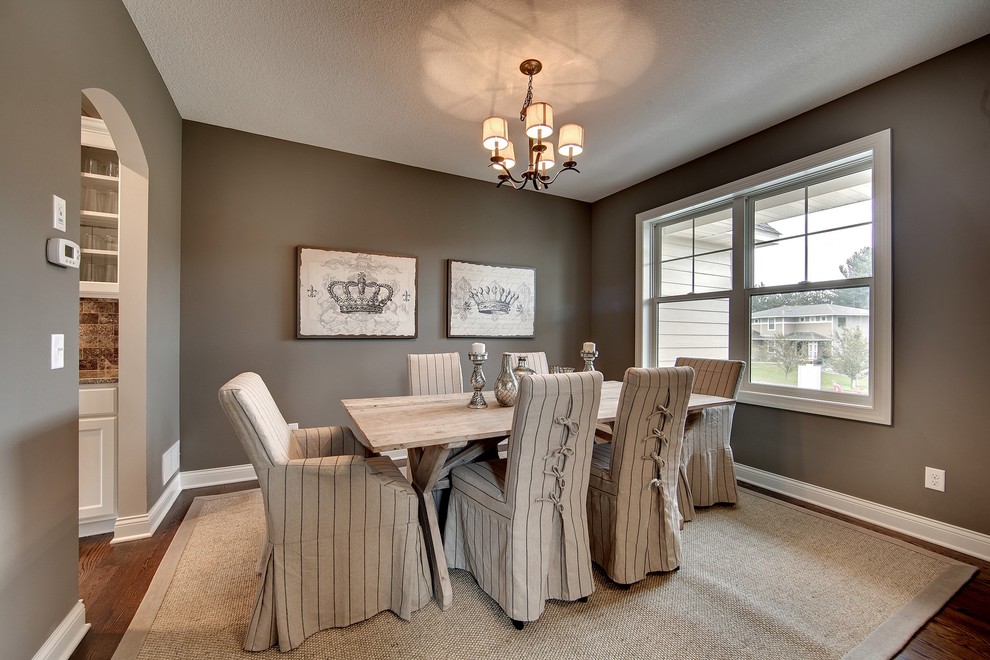 Photo of a large traditional separate dining room in Minneapolis with grey walls, dark hardwood floors and no fireplace.