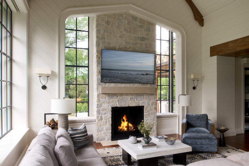 Inspiration for a transitional open concept dark wood floor, vaulted ceiling and shiplap wall living room remodel in Philadelphia with a standard fireplace and a stone fireplace