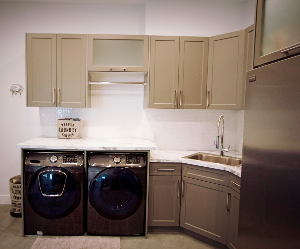 Modern u-shaped utility room in Other with a drop-in sink, shaker cabinets, brown cabinets, quartzite benchtops, white walls, a side-by-side washer and dryer, beige floor and white benchtop.