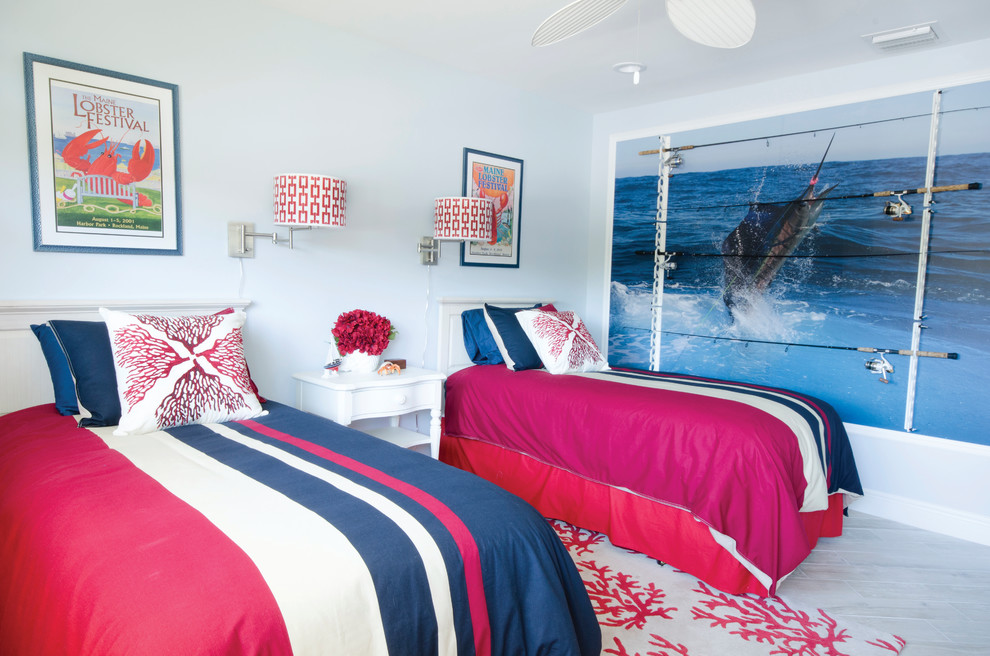 This is an example of a mid-sized beach style guest bedroom in Miami with blue walls, porcelain floors and no fireplace.