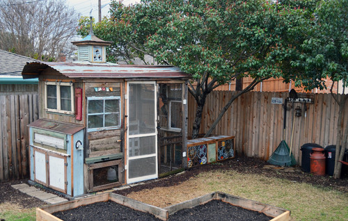 This DIY chicken coop is the perfect combination of vintage design pieces and functionality. The full size doorway and ample windows provide ease of access, while the multicolored facades stands out in any yard.