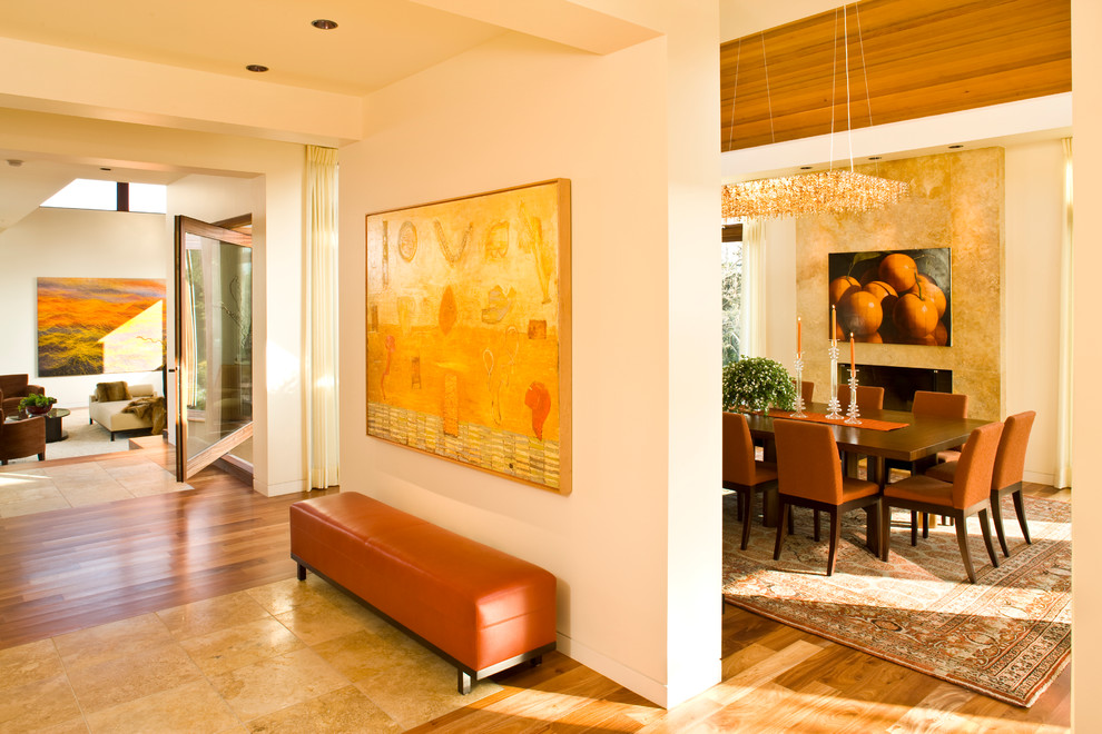 Design ideas for a contemporary hallway in San Diego with white walls, medium hardwood floors and yellow floor.