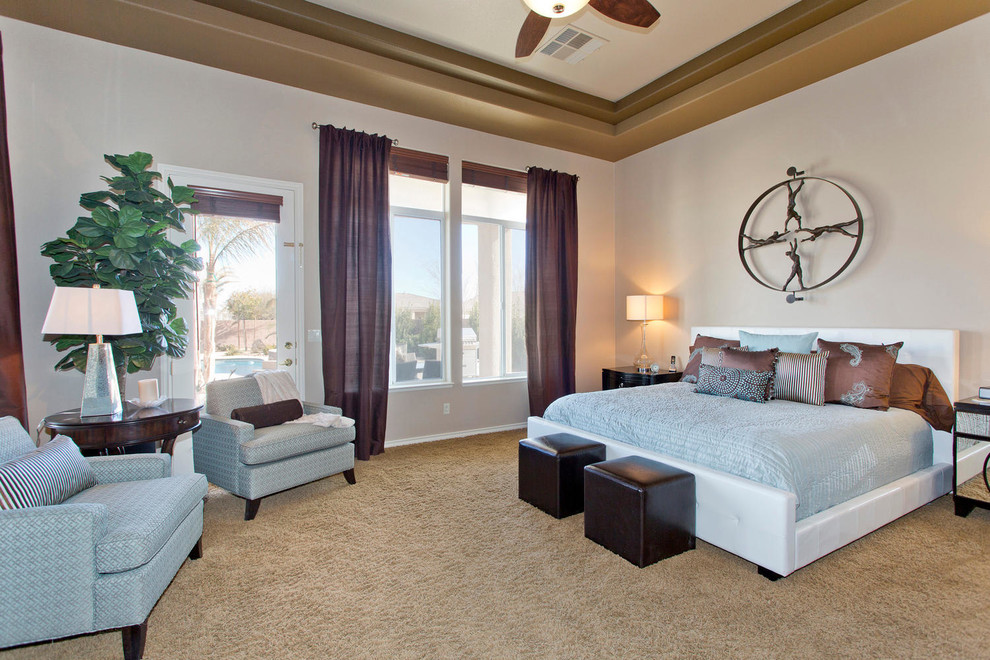 Photo of a traditional master bedroom in Las Vegas with beige walls, carpet and no fireplace.