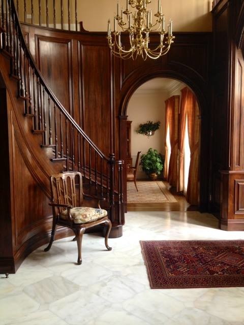 Design ideas for a large traditional foyer in Chicago with brown walls, marble floors and white floor.