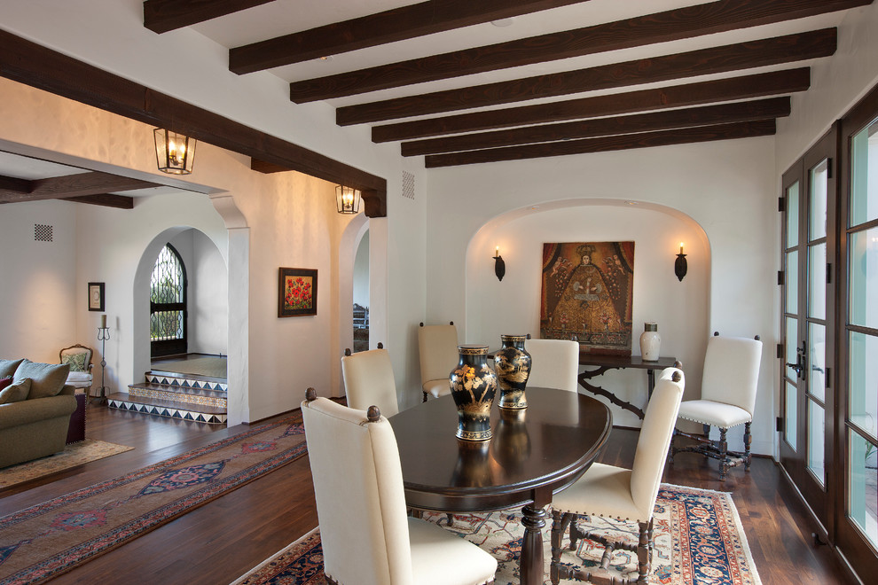 Photo of a mediterranean dining room in Santa Barbara with white walls.