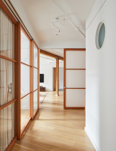 Full Apartment Renovation Using Multiple Sliding Walls mid-century-flur