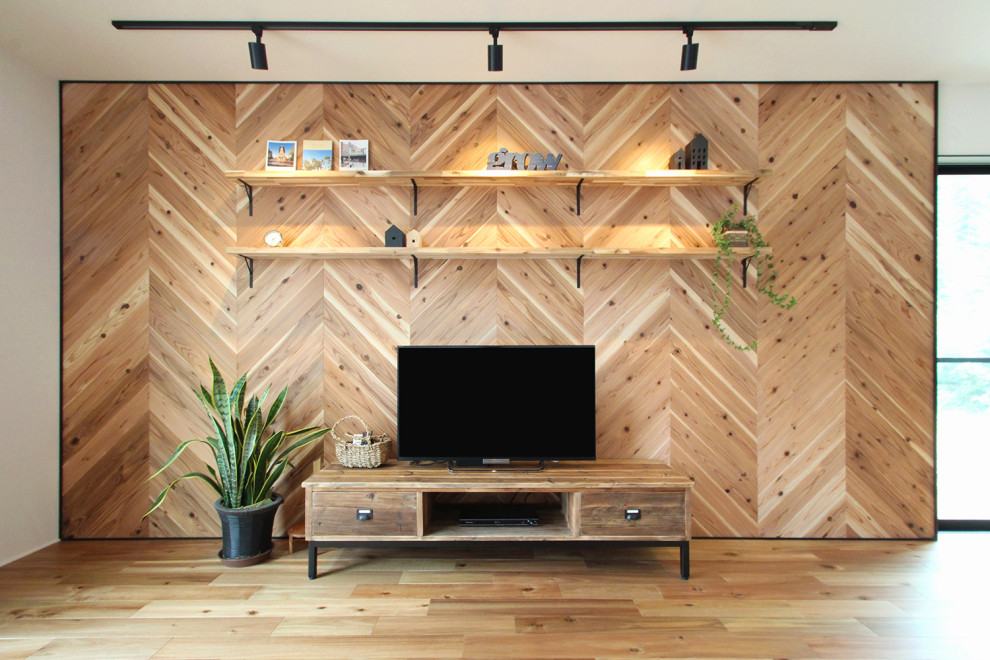 Photo of an industrial open plan living room feature wall in Other with brown walls, dark hardwood flooring, a freestanding tv, a wallpapered ceiling and wood walls.