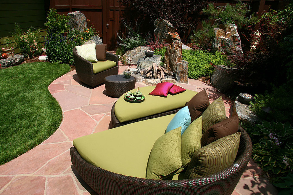 Patio - small transitional backyard stone patio idea in Denver with a fire pit and no cover