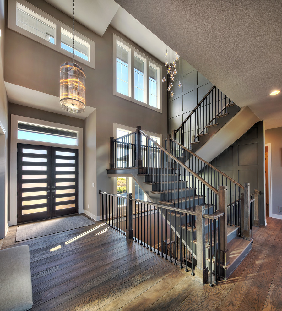 This is an example of an expansive transitional floating staircase in Kansas City.