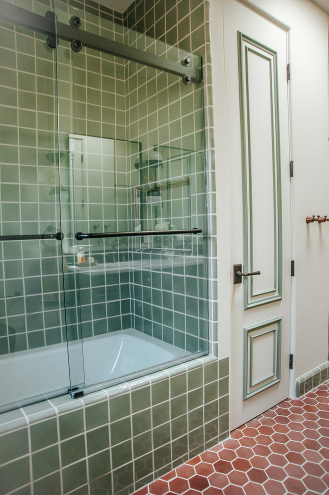 Medium sized classic family bathroom in Los Angeles with a corner bath, a shower/bath combination, green tiles, ceramic tiles, green walls, ceramic flooring, multi-coloured floors, a sliding door and a floating vanity unit.