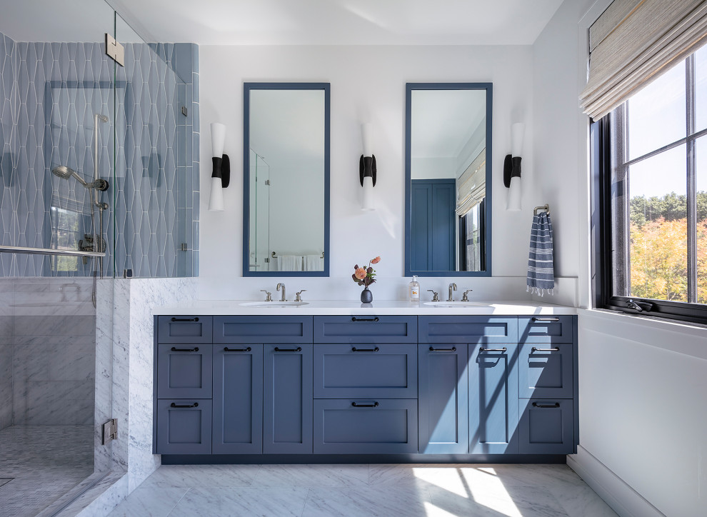 Transitional bathroom in San Francisco with shaker cabinets, blue cabinets, an alcove shower, blue tile, white walls, an undermount sink, grey floor, a hinged shower door and white benchtops.