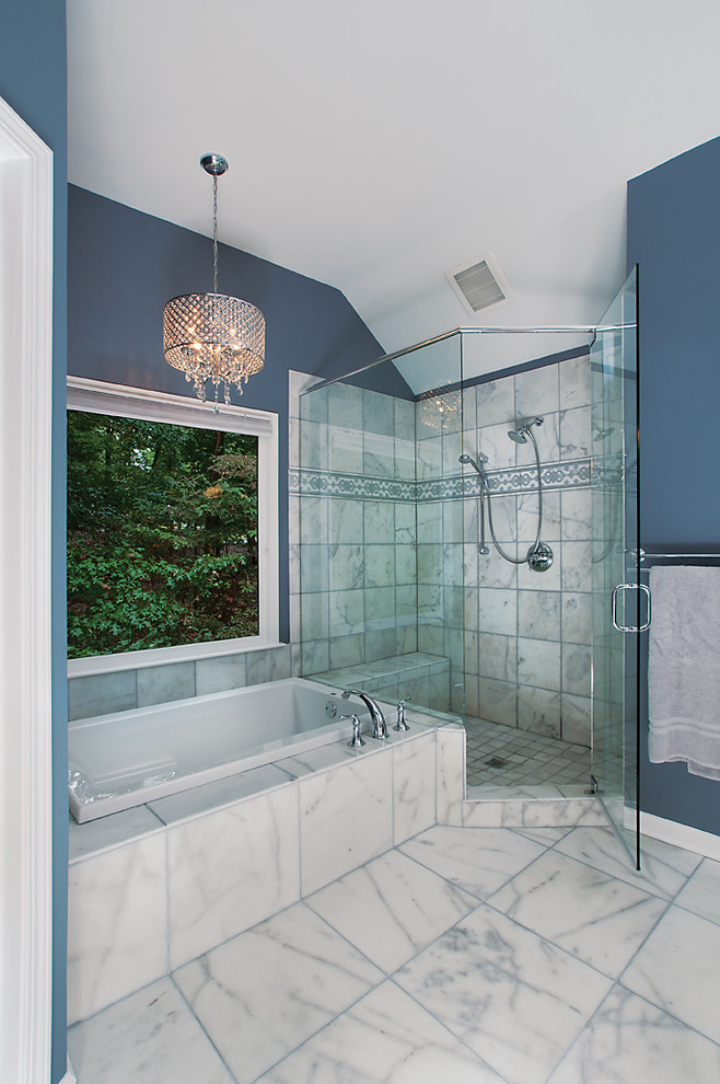 Photo of a traditional bathroom in Atlanta with an alcove tub, a corner shower, white tile and grey walls.