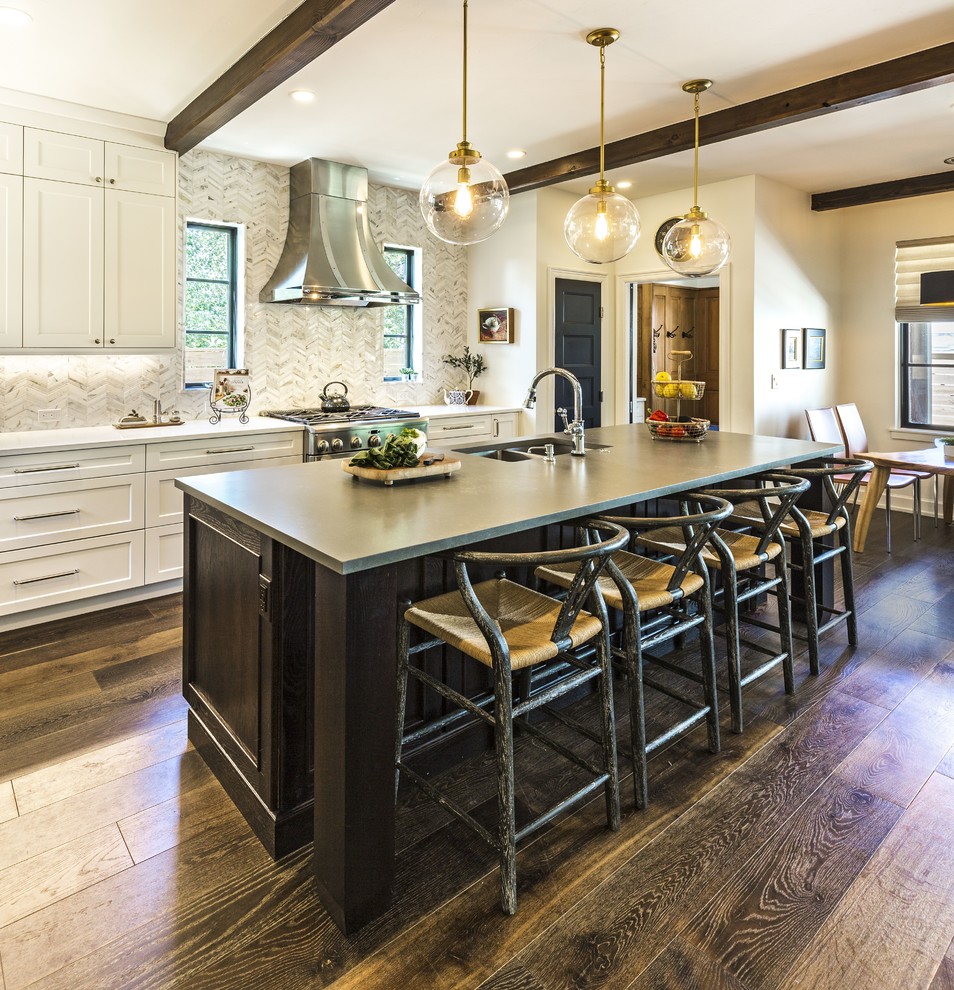 Photo of a transitional eat-in kitchen in Albuquerque with a double-bowl sink, shaker cabinets, white cabinets, multi-coloured splashback, stainless steel appliances, dark hardwood floors, with island, brown floor and grey benchtop.