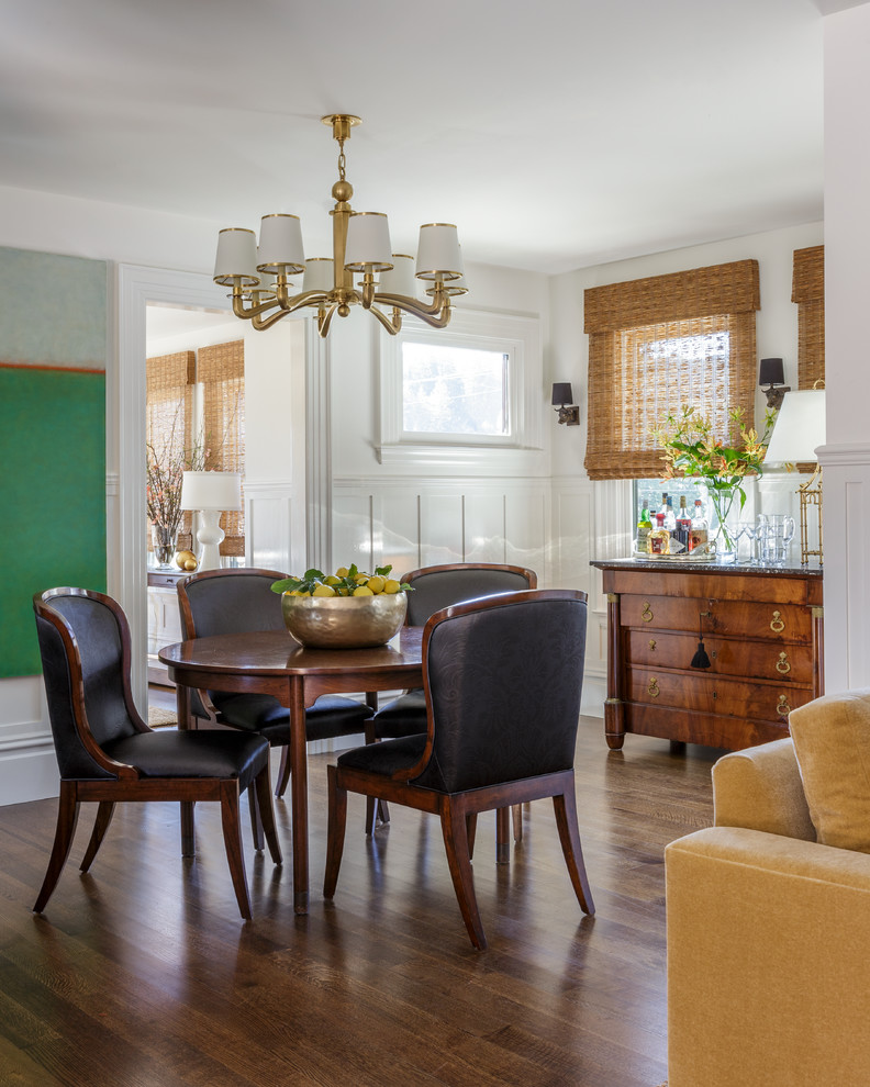 This is an example of a mid-sized traditional open plan dining in San Francisco with white walls, dark hardwood floors, brown floor and no fireplace.