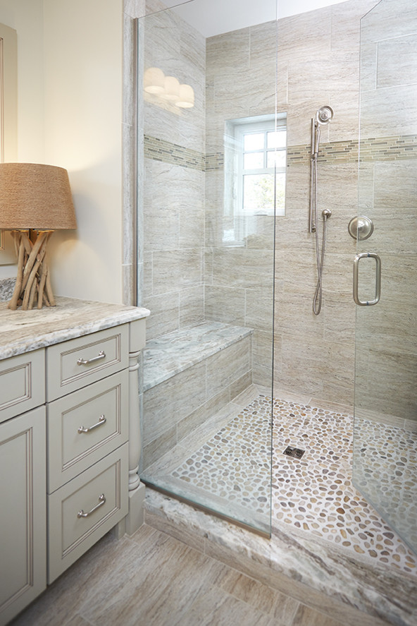 Large beach style master bathroom in Grand Rapids with furniture-like cabinets, a corner shower, a two-piece toilet, multi-coloured tile, ceramic tile, green walls, ceramic floors, an undermount sink, granite benchtops and grey cabinets.