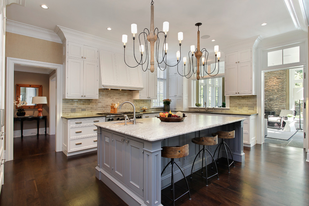Kitchen - transitional kitchen idea in Chicago with recessed-panel cabinets, white cabinets, multicolored backsplash and stainless steel appliances