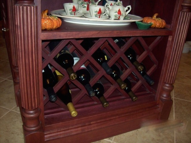 Inspiration for a large ceramic tile wine cellar remodel in Cedar Rapids with storage racks