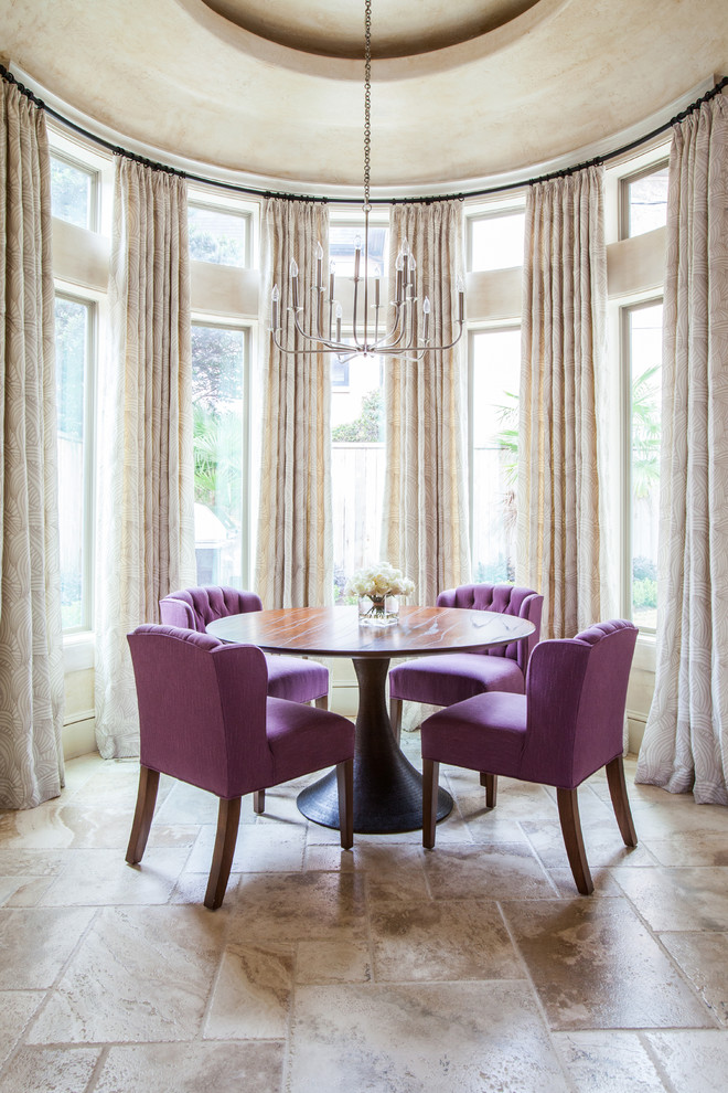 Example of a transitional dining room design in Houston with beige walls and no fireplace
