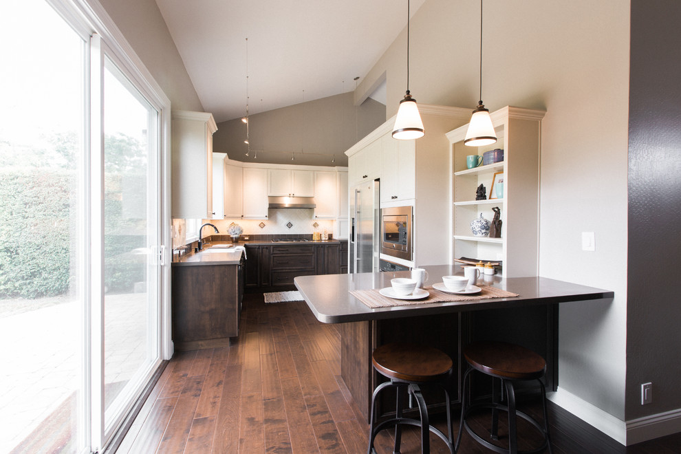 Design ideas for a transitional eat-in kitchen in San Francisco with brown cabinets and a peninsula.