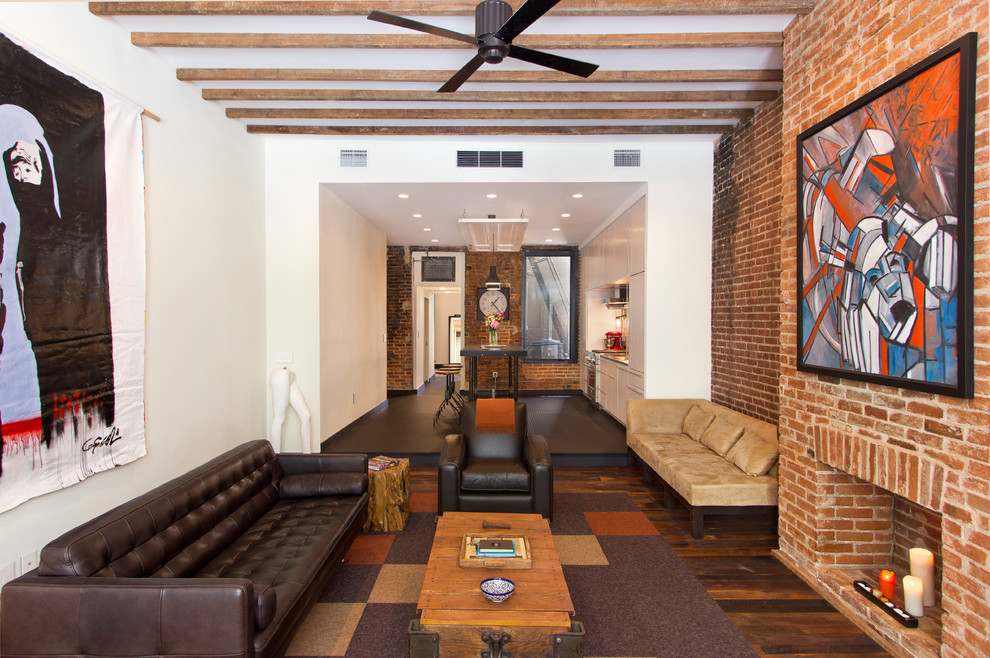 Living room - industrial formal medium tone wood floor living room idea in DC Metro with white walls, a standard fireplace, a brick fireplace and no tv