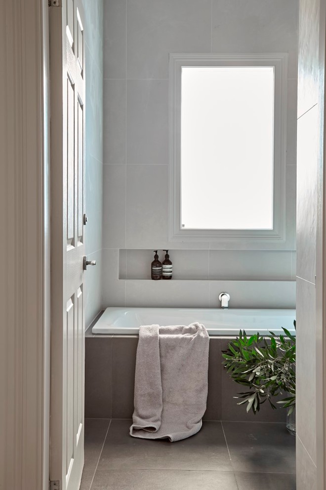 Design ideas for a mid-sized transitional master bathroom in Sydney with shaker cabinets, beige cabinets, a drop-in tub, a corner shower, brown tile, porcelain tile, beige walls, porcelain floors, an integrated sink and solid surface benchtops.