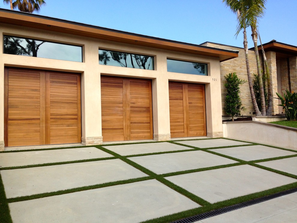 Carport - large tropical attached three-car carport idea in Orange County