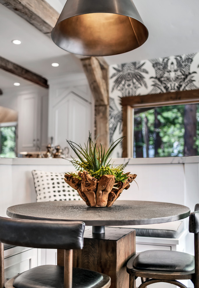 Example of a mountain style l-shaped brown floor and dark wood floor eat-in kitchen design with gray walls, no fireplace, a farmhouse sink, recessed-panel cabinets, white cabinets, quartzite countertops, white backsplash, stone slab backsplash, stainless steel appliances, two islands and white countertops