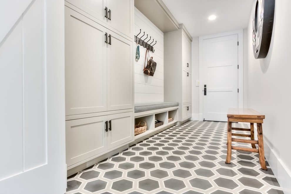 Design ideas for a mid-sized country mudroom in Orange County with grey walls, a single front door, a white front door, concrete floors and multi-coloured floor.