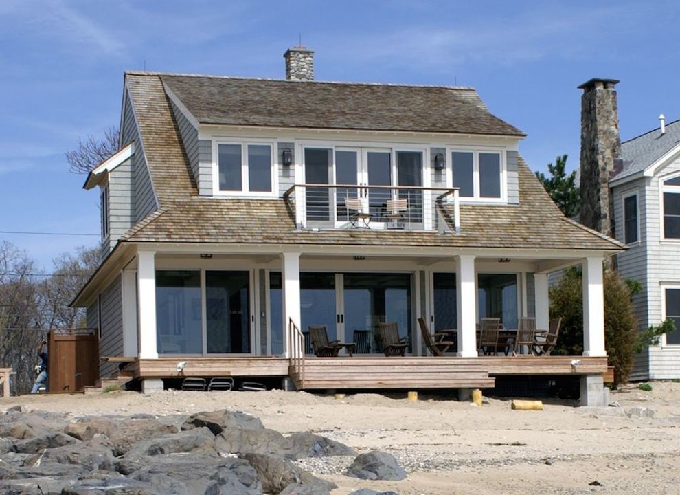 Inspiration for a mid-sized beach style two-storey grey house exterior in New York with wood siding, a gable roof and a shingle roof.