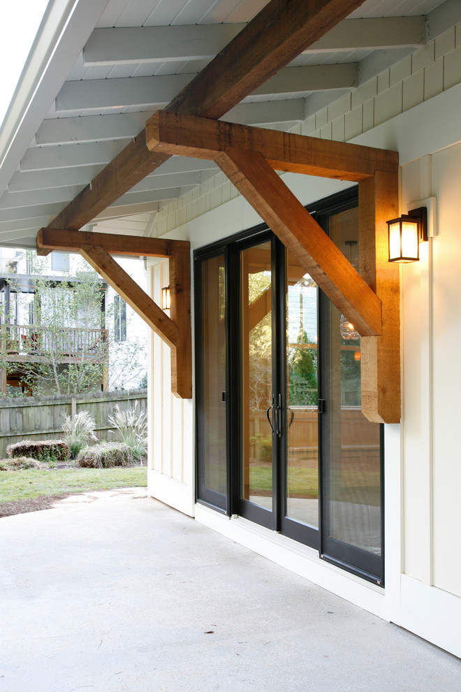 Inspiration for a mid-sized arts and crafts one-storey concrete black exterior in Atlanta with a gable roof.