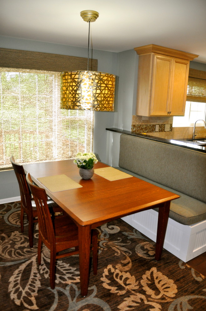 Photo of a mid-sized transitional single-wall eat-in kitchen in Cincinnati with an undermount sink, shaker cabinets, light wood cabinets, granite benchtops, beige splashback, mosaic tile splashback, stainless steel appliances and dark hardwood floors.