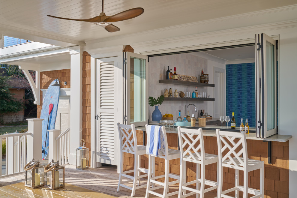 Huge beach style wood and shingle orange porch photo