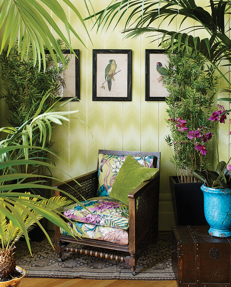 Inspiration for a mid-sized tropical formal open concept living room in Berlin with green walls, medium hardwood floors, no fireplace and no tv.