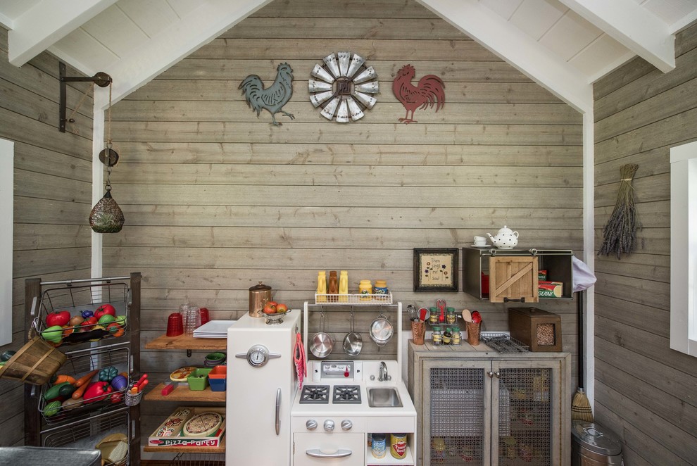 Photo of a country kids' playroom in Dallas with brown walls.
